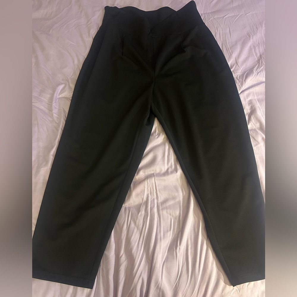 Never worn. Criss cross trousers, size 3X.